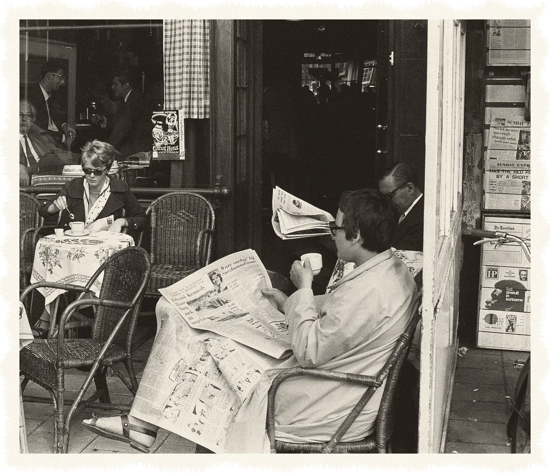 People at a cafe read the Moon landing edition of the paper, Amsterdam, 21 July 1969